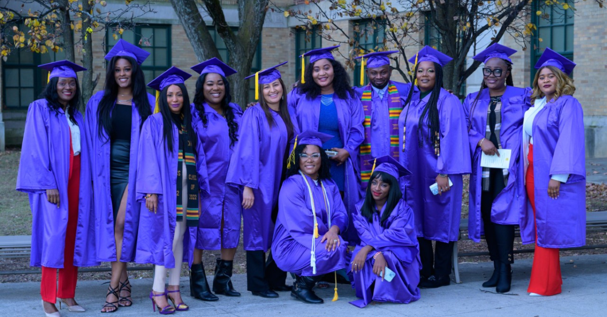 adults in caps and gowns
